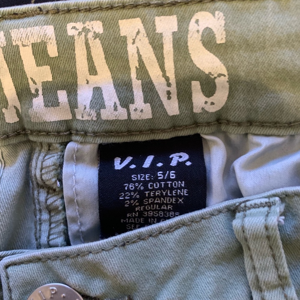 Green jeans with fringed ends